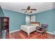 Bedroom with cherry wood flooring, and a window with curtains at 4037 Se 40Th St, Ocala, FL 34480