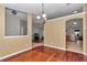 Elegant dining room featuring hardwood floors, neutral paint, and decorative light fixture at 4037 Se 40Th St, Ocala, FL 34480
