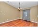 Formal dining room with hardwood floors, chandelier, and neutral walls at 4037 Se 40Th St, Ocala, FL 34480