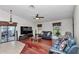 Living room with a ceiling fan, tile floor, and glass sliding door at 4037 Se 40Th St, Ocala, FL 34480