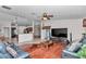 Spacious living room features hardwood floors, ceiling fan, and view of the kitchen at 4037 Se 40Th St, Ocala, FL 34480