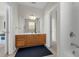 Bright bathroom boasts vanity with ample storage, large mirror, and accessible tub, creating a practical and inviting atmosphere at 4102 Breakview Dr # 30603, Orlando, FL 32819