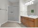 Well-lit bathroom featuring a shower and a vanity with ample counter space at 4102 Breakview Dr # 30603, Orlando, FL 32819
