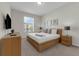 Bright bedroom with neutral tones and ample natural light streaming through the window at 4102 Breakview Dr # 30603, Orlando, FL 32819