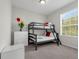 Bright bedroom showcases bunk beds, white dresser, and natural light, perfect for or guests at 4102 Breakview Dr # 30603, Orlando, FL 32819