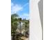 Scenic view of a lake framed by palm trees and modern architecture, blending nature with urban living at 4102 Breakview Dr # 30603, Orlando, FL 32819