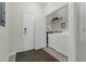 Functional laundry room with washer, dryer, and ample shelving at 4102 Breakview Dr # 30603, Orlando, FL 32819