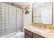 Bathroom featuring a framed mirror, granite countertops and a shower-tub combination at 442 Anessa Rose Loop, Ocoee, FL 34761