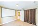 Cozy bonus room features a sliding barn door and a large screen for entertainment at 442 Anessa Rose Loop, Ocoee, FL 34761
