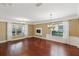 Bright living room with hardwood floors, crown molding, and abundant natural light at 442 Anessa Rose Loop, Ocoee, FL 34761