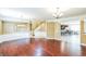 Open-concept dining room and living room featuring hard wood flooring and kitchen view at 442 Anessa Rose Loop, Ocoee, FL 34761