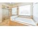 Relaxing main bathroom with a soaking tub and separate glass enclosed shower at 442 Anessa Rose Loop, Ocoee, FL 34761