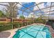 Lush landscaping surrounds this inviting pool, offering privacy and a serene retreat at 442 Anessa Rose Loop, Ocoee, FL 34761