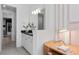 Well-lit bathroom featuring a vanity with a dark countertop, a light fixture and a desk at 4709 Flagstaff Ct, Orlando, FL 32820