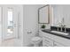 Modern bathroom with a sleek vanity, walk-in shower, and access to the backyard at 4709 Flagstaff Ct, Orlando, FL 32820