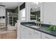 Bathroom view showcasing vanity with dark countertop, modern fixtures, and bunkroom views with decorative elements at 4709 Flagstaff Ct, Orlando, FL 32820