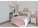 Comfortable bedroom featuring stylish decor and an adjacent bathroom at 4709 Flagstaff Ct, Orlando, FL 32820