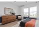 Bedroom boasts a modern ceiling fan, large windows, and stylish wooden dresser at 4709 Flagstaff Ct, Orlando, FL 32820