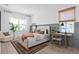 Bright bedroom features a large bed, stylish furniture, wood floors, and neutral decor for a cozy and modern aesthetic at 4709 Flagstaff Ct, Orlando, FL 32820