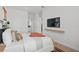 Bright bedroom featuring a modern style, white walls, light wood floors, and contemporary decor, creating a relaxing and airy space at 4709 Flagstaff Ct, Orlando, FL 32820
