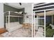 Fun bunkroom with white bunkbeds, seating, work space, Mickey Mouse light, and olive green accent wall at 4709 Flagstaff Ct, Orlando, FL 32820