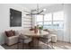 Bright dining area with a round table, banquette seating, and large windows with a lake view at 4709 Flagstaff Ct, Orlando, FL 32820