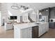 Bright kitchen boasts a large center island, stainless steel appliances, and pendant lighting at 4709 Flagstaff Ct, Orlando, FL 32820
