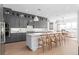 Spacious kitchen with stainless steel appliances, large island, and gray cabinets at 4709 Flagstaff Ct, Orlando, FL 32820