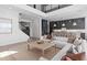 Open-concept living room with a large sectional sofa and a kitchen view at 4709 Flagstaff Ct, Orlando, FL 32820