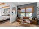 Stylish living room adjacent to the primary bedroom boasts chic furnishings and natural light, perfect for relaxation and intimate gatherings at 4709 Flagstaff Ct, Orlando, FL 32820