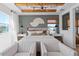 Bright and airy bedroom with elegant seating and modern decor, featuring natural wood accents and ample natural light at 4709 Flagstaff Ct, Orlando, FL 32820
