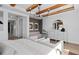 Elegant main bedroom showcasing wood beam ceilings, designer furnishings, and a bright, airy atmosphere at 4709 Flagstaff Ct, Orlando, FL 32820