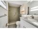 Accessible bathroom with a walk-in shower, granite countertop, and grab bars, ensuring safety and convenience at 5144 Orange Ave, Winter Park, FL 32792