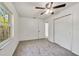 Bright bedroom featuring a ceiling fan and neutral colors, complete with a closet at 5144 Orange Ave, Winter Park, FL 32792
