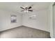 Bright bedroom with plush carpet, ceiling fan and two windows providing lots of natural light at 5144 Orange Ave, Winter Park, FL 32792