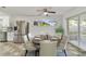 Bright dining room with a modern ceiling fan, elegant table setting, and sliding glass doors at 5144 Orange Ave, Winter Park, FL 32792