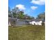 Charming single-story home with a well-manicured lawn and a carport, perfect for easy parking at 5144 Orange Ave, Winter Park, FL 32792