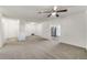 Spacious living room with plush carpeting, ceiling fan, and neutral color palette, great for entertaining at 5144 Orange Ave, Winter Park, FL 32792