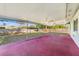 Spacious screened patio with ceiling fans offering an outdoor living space with views of the backyard at 5144 Orange Ave, Winter Park, FL 32792