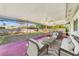 Relaxing screened-in patio with comfortable seating and views of the landscaped backyard at 5144 Orange Ave, Winter Park, FL 32792