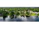Aerial view of the lakefront community showcasing lush trees, backyard docks, and waterfront homes at 5301 Pineview Way, Apopka, FL 32703