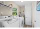 Laundry room with updated washer and dryer units at 5301 Pineview Way, Apopka, FL 32703