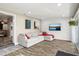 Spacious living room with textured wall, modern lighting, and sliding door access at 5301 Pineview Way, Apopka, FL 32703