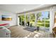 Relaxing sun room with large sliding doors, view to a beautiful garden and backyard at 5301 Pineview Way, Apopka, FL 32703