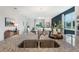 Open-concept kitchen featuring granite counters, a double sink, and views into the dining and living areas at 5925 Cliffbow Loop, Leesburg, FL 34748