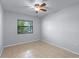 Bright bedroom with tile floors and large window offering ample natural light at 622 Mount Homer Rd # 622, Eustis, FL 32726