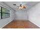 Bright living room with hardwood floors, neutral walls and modern ceiling fan at 622 Mount Homer Rd # 622, Eustis, FL 32726