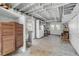The unfinished basement is spacious with an open ceiling and a walk-out door at 639 John Anderson Dr, Ormond Beach, FL 32176