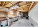 The unfinished basement has pegboards and shelving perfect for a workshop area at 639 John Anderson Dr, Ormond Beach, FL 32176
