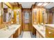 Expansive bathroom features dual sinks, vanity, and wooden cabinets, providing ample storage at 639 John Anderson Dr, Ormond Beach, FL 32176